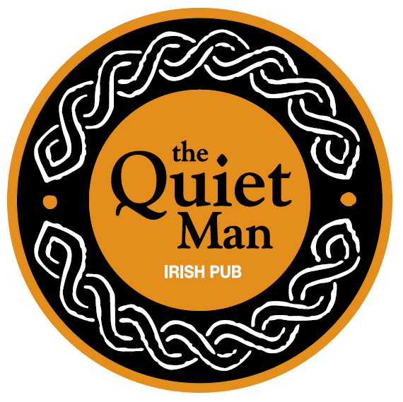 a circular orange and black logo with the Quiet Man Irish pub written inside